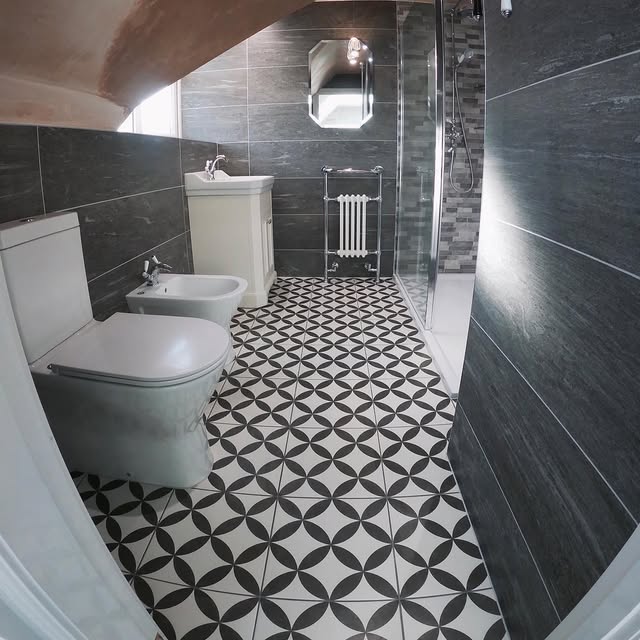 Black and white splitface tiling installed in Barkby